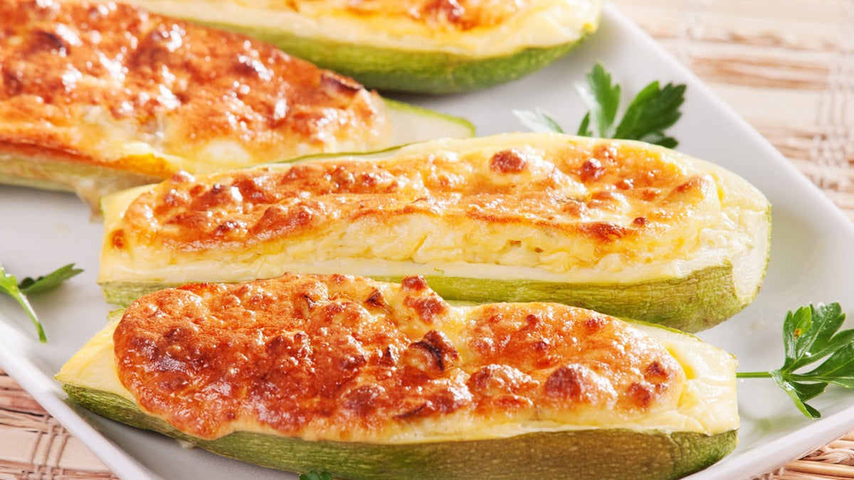Baked zucchini potato skins topped with melted cheese