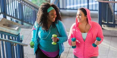Two women walking together outdoors
