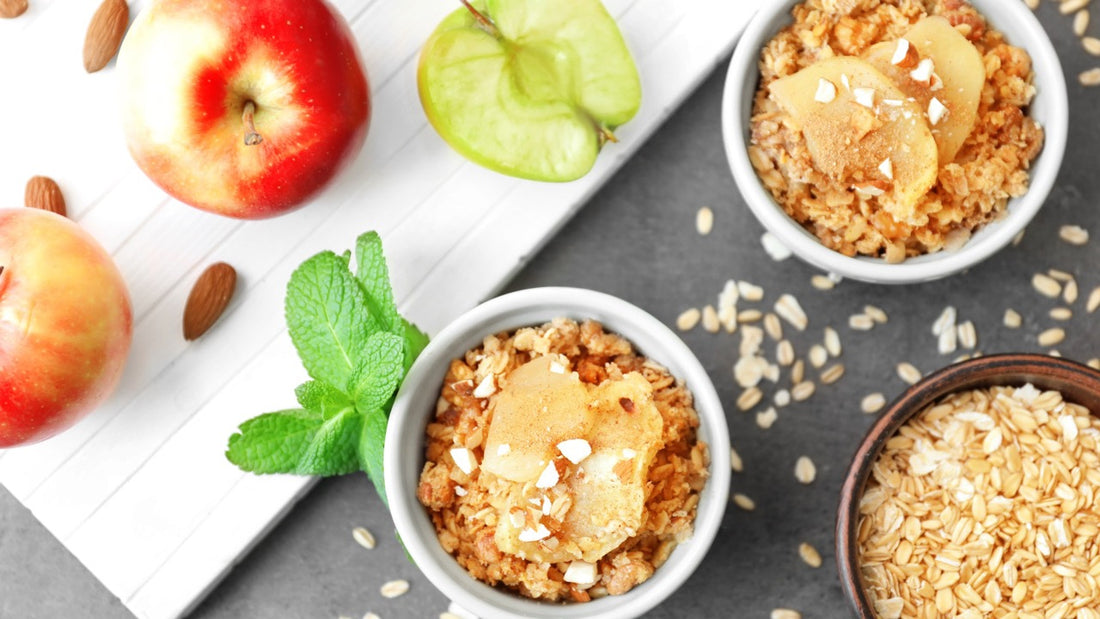 Bowls of apple crisp with fresh apples