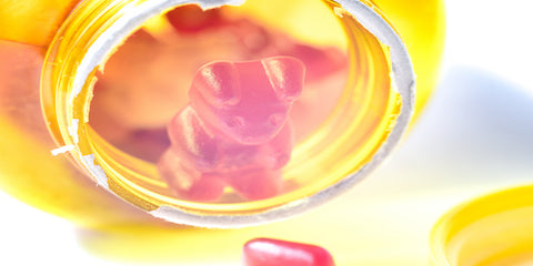 Close-up of colorful chewable vitamins in a glass jar