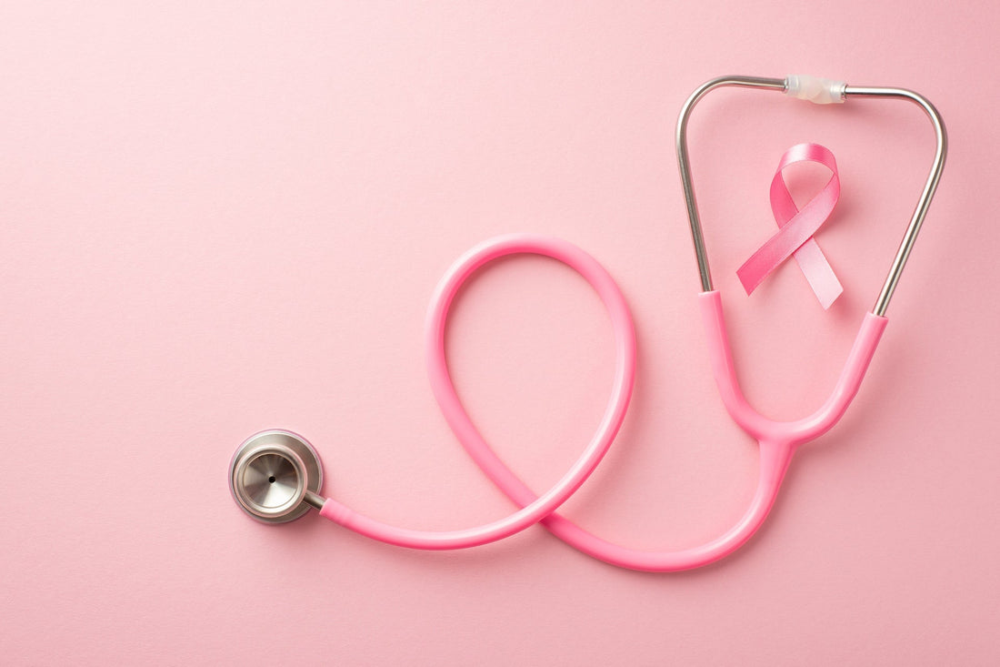 Pink stethoscope shaped like a cancer awareness ribbon on a pink background