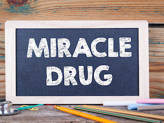 Chalkboard sign reading miracle drug