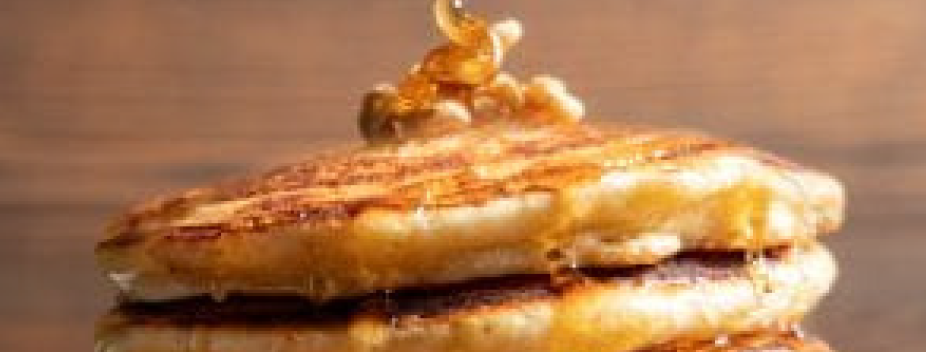 Stack of vanilla protein pancakes with syrup