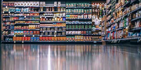 Grocery store aisle stocked with packaged foods