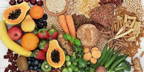 High-fiber foods including grains, legumes, fruits and vegetables