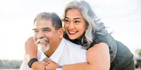 Smiling older couple embracing