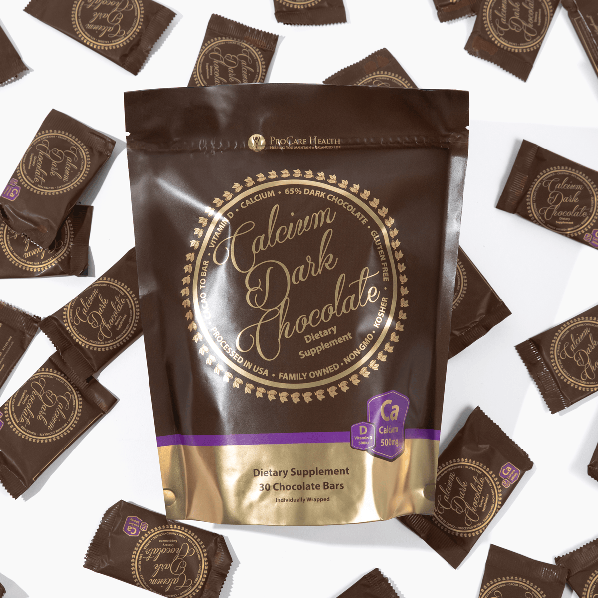 30ct bag of Calcium Dark Chocolate Bars laying on top of scattered 1ct packages of the Calcium Dark Chocolate Bars
