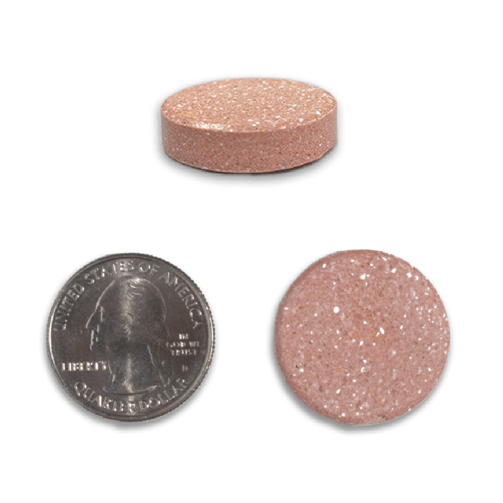 FPSizeChewable tablet next to a quarter.